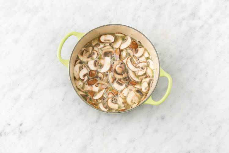 Cook mushrooms.