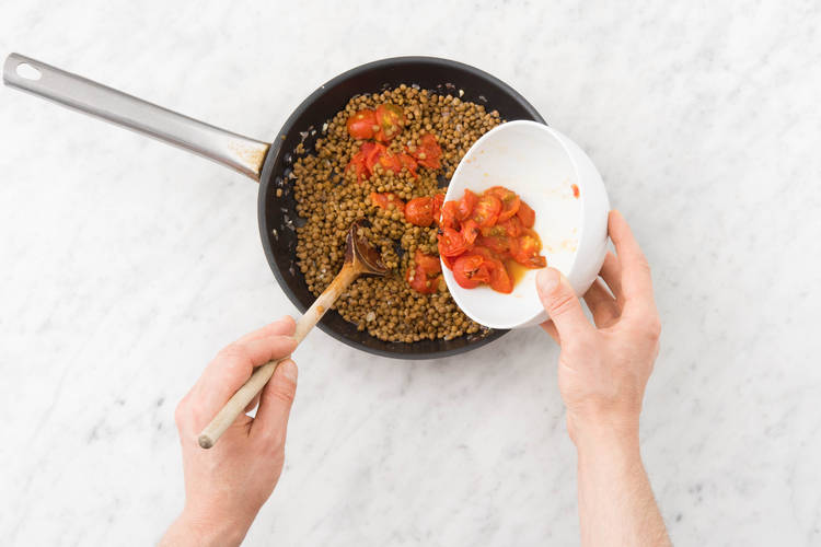 Add tomatoes to lentils.