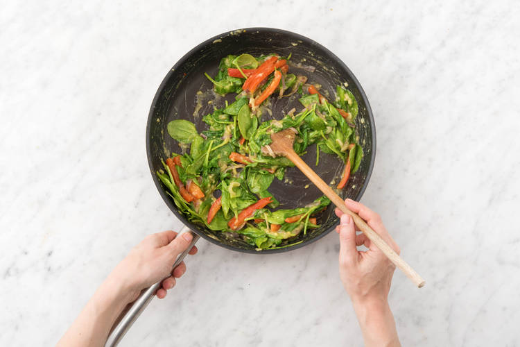Cook spinach.