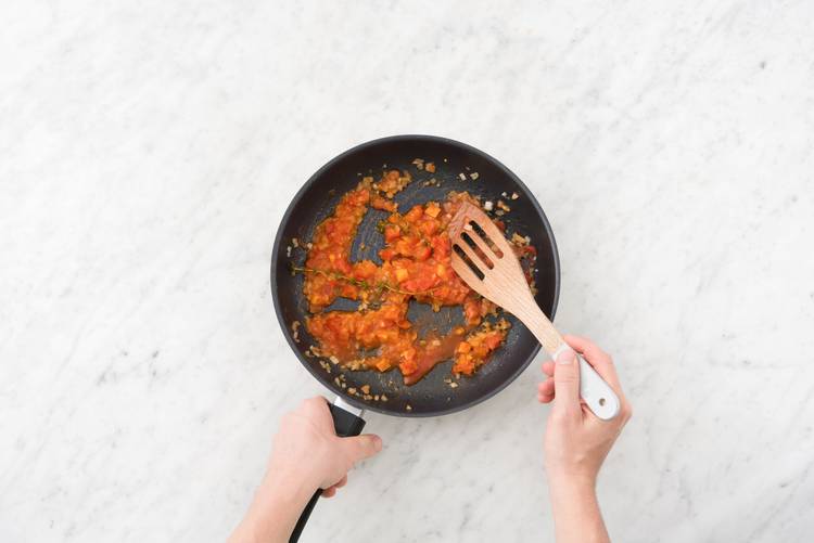 Cook the onion and tomato