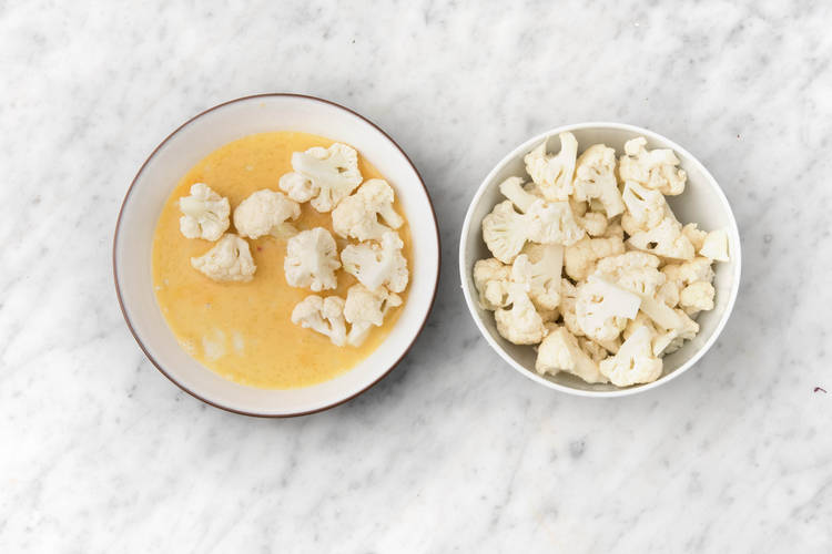 Toss the cauliflower in the egg mixture