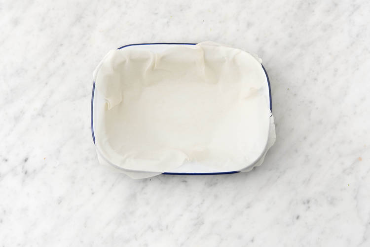 Lay half the sheets of filo pastry in a medium greased baking dish