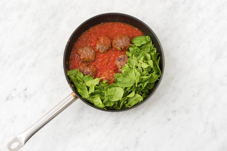 Add chopped tomatoes and spinach.