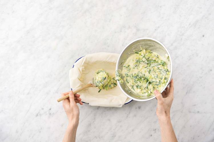 Spoon the silverbeet and ricotta mixture into the centre of the baking dish