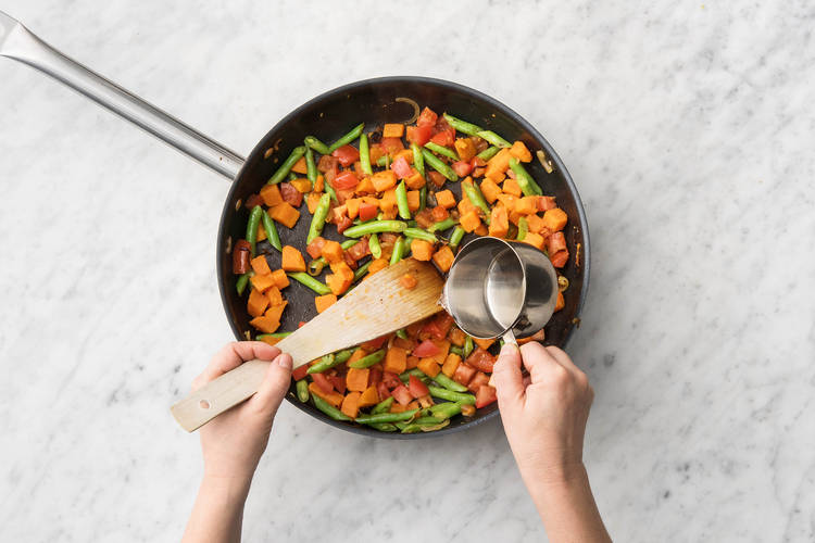 Cook veggies.