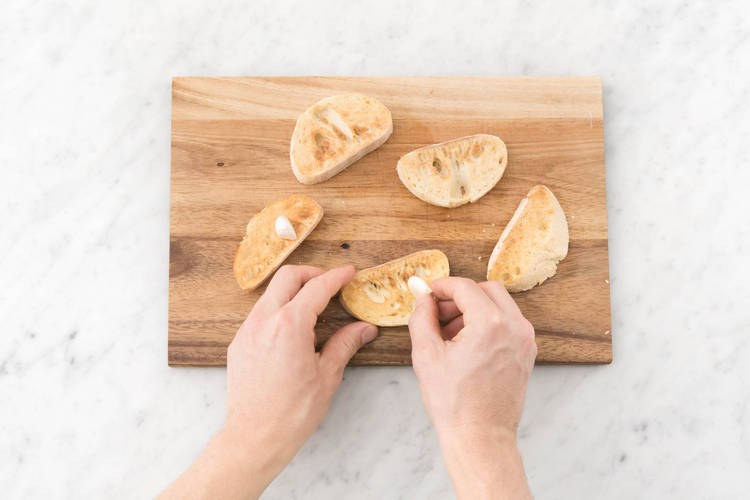 Rub garlic over ciabatta.