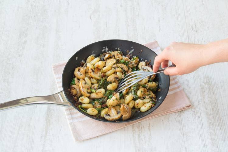 Stir through the parsley, Parmesan cheese, and baby spinach