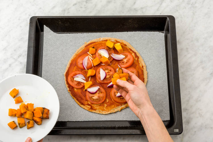 Top the pizza bases