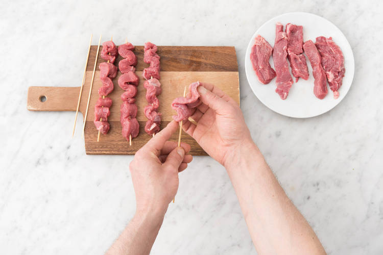 Weave the beef strips onto the skewers