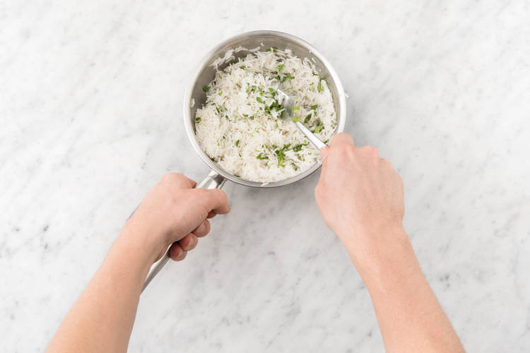 Stir the coriander leaves through the rice
