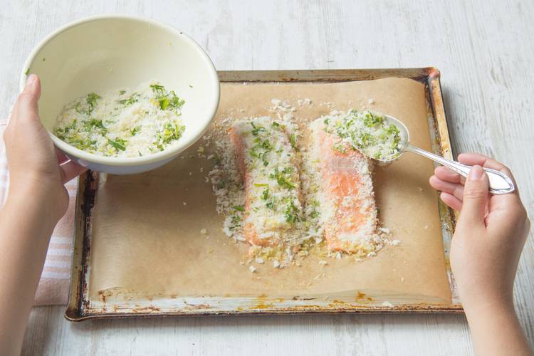 Spoon the crumb mixture onto the top side of the salmon