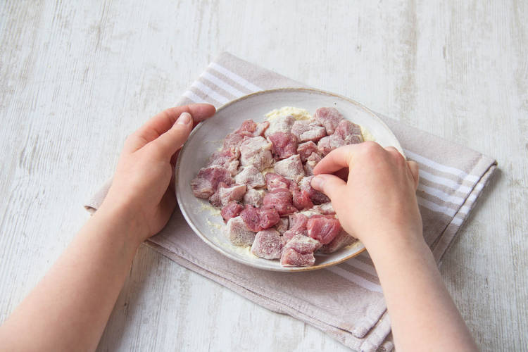 Coat pork in cornflour.