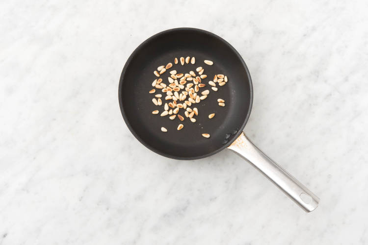 Toast pine nuts.