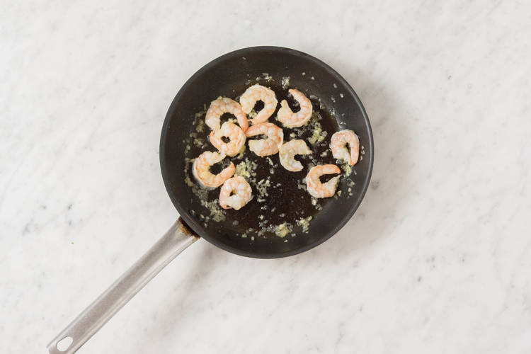 Cook prawns.