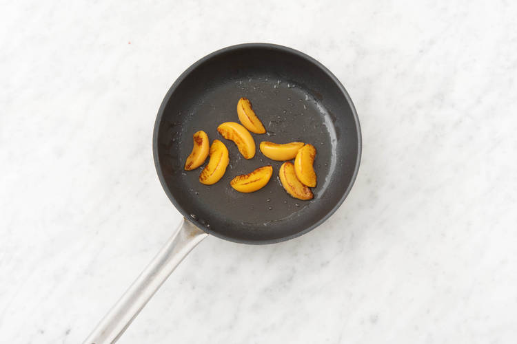 Grill the peach wedges