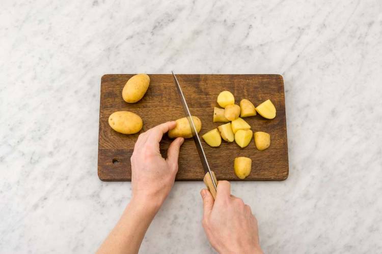 Preheat oven and boil potatoes