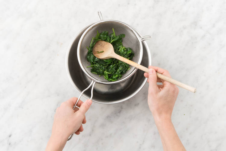 Drain spinach.