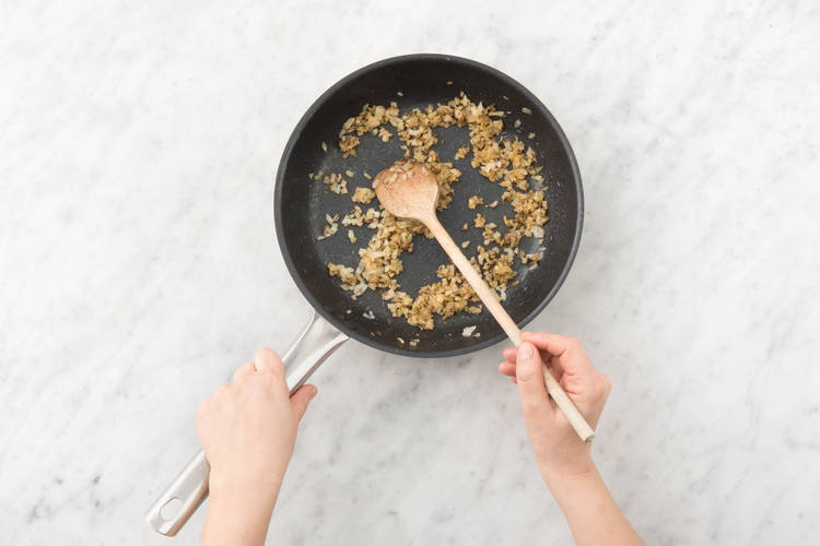 Cook onion and spice.