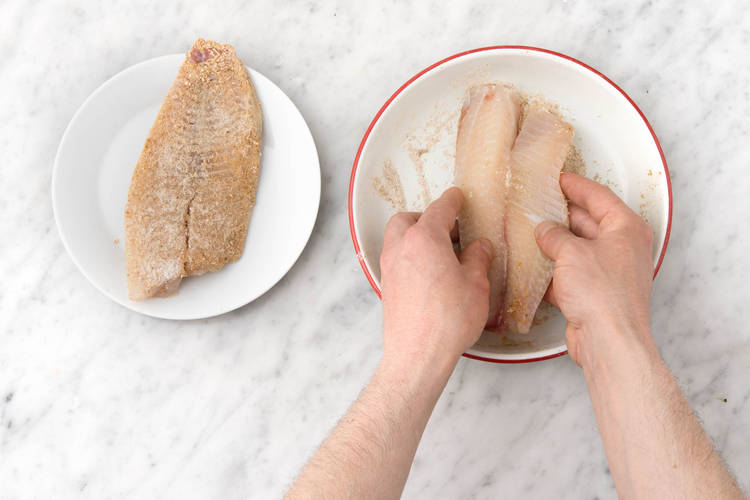 Coat fish in spice and flour.