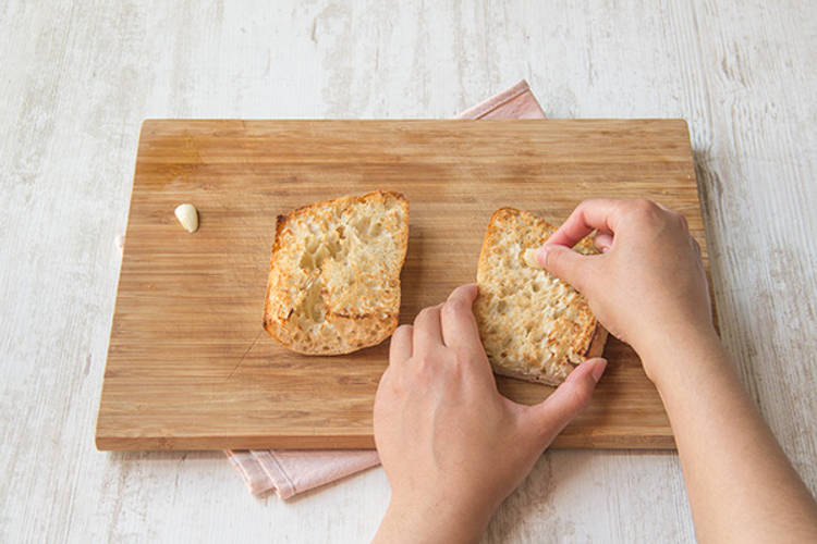 Rub garlic over ciabatta.