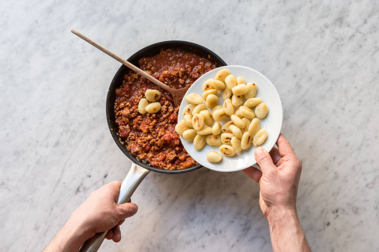 Add the gnocchi to the Bolognese sauce