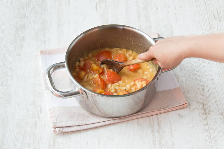 Add the tomatoes and simmer