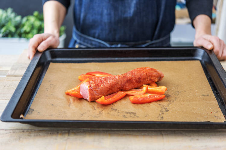 Place the pork on top of the peppers