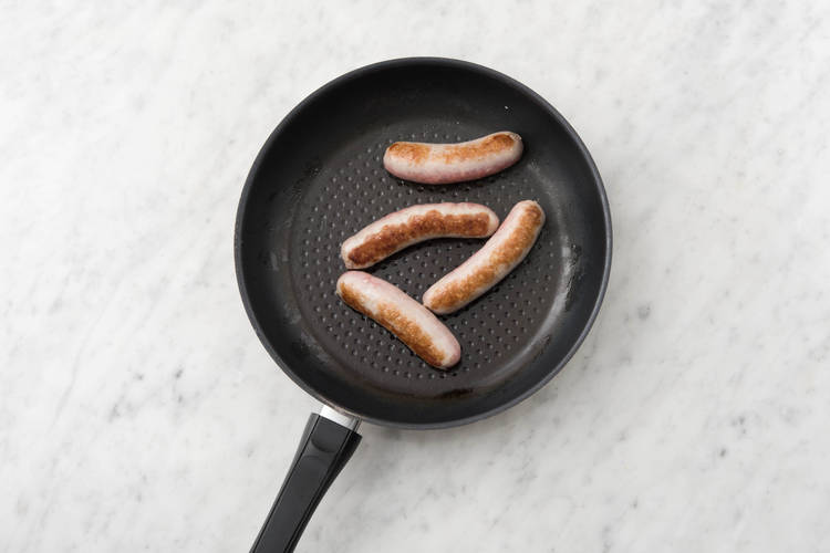 Cook sausage.