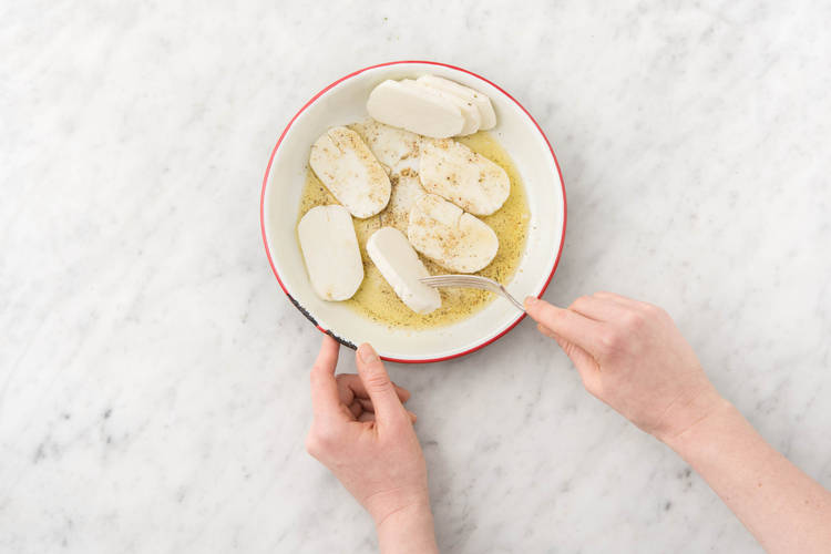 Coat the haloumi