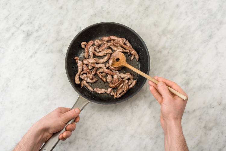 Sear the beef strips