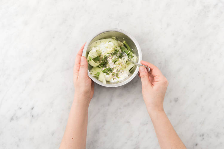 Peel cucumber into strips