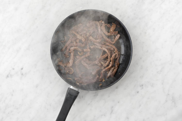 Brown the beef strips