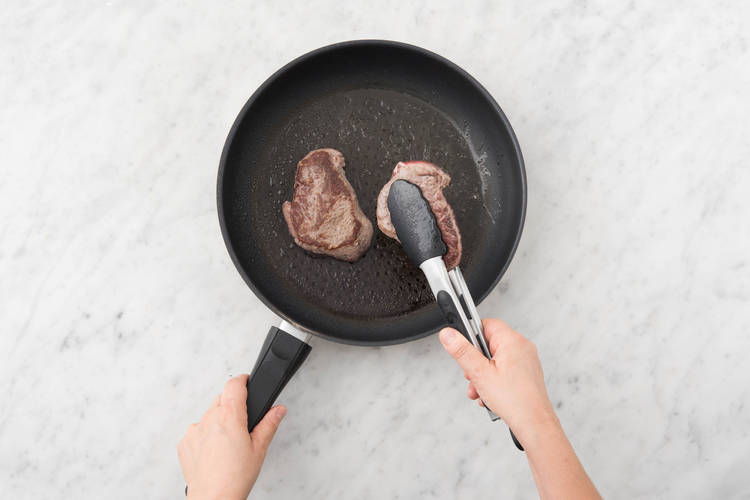 Cook the steaks on each side