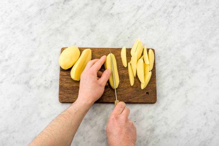 Cut the potatoes into 1/2-inch wedges