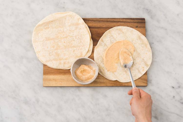 Spread mayo between tortillas