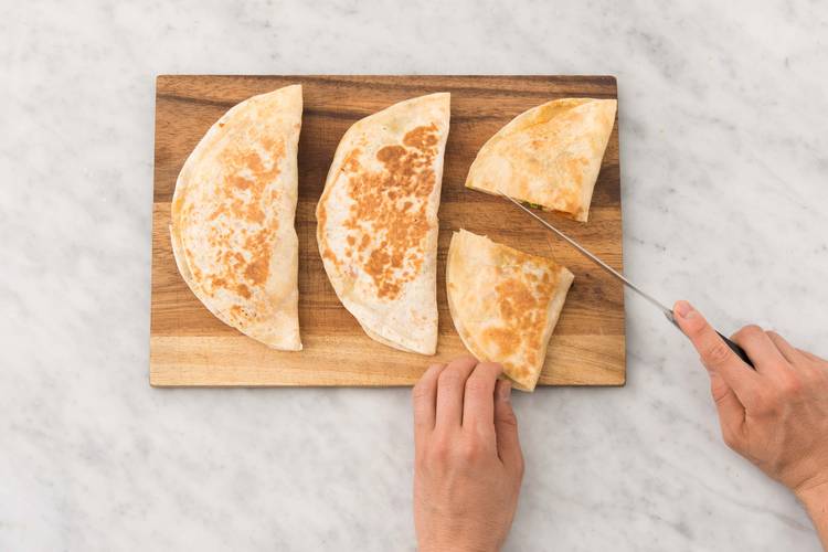 Cut the warm quesadillas into wedges
