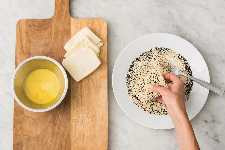 Coat the haloumi